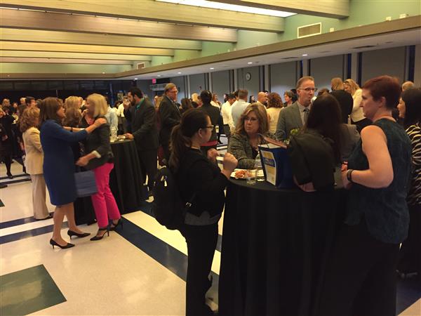 Crowd of adults inside the Chino Hills High MPR